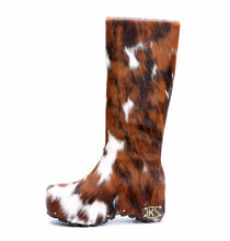 Brown and white cow print boot on a white background