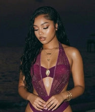 Close up of gold centerpiece and mesh plunge detail on burgundy luxury monokini swimsuit