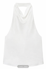 Ivory silk satin halter top with elegant draped neckline and refined silhouette