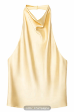 Champagne-colored satin halter top on a white background