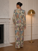     Sophisticated floral pantsuit for women in soft blush, sage, lavender, and apricot tones