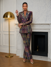 Elegant women’s plaid two piece suit featuring gold tone buttons and structured tailoring